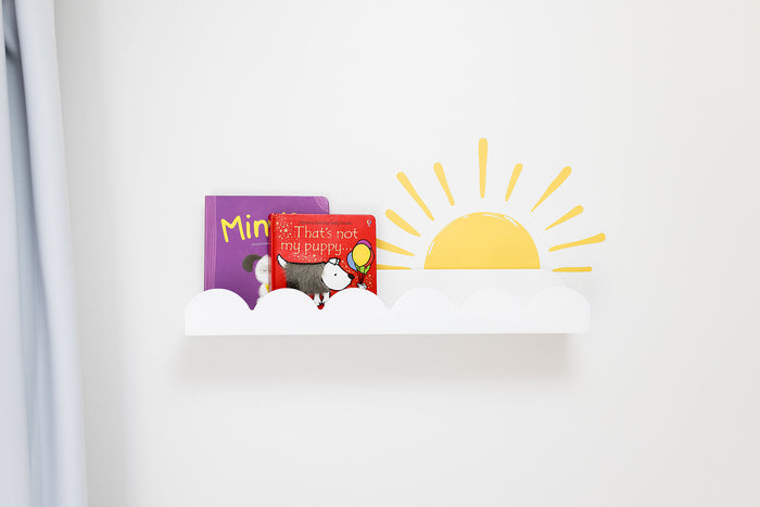 Children's book with a sun decal sticker on a white wall