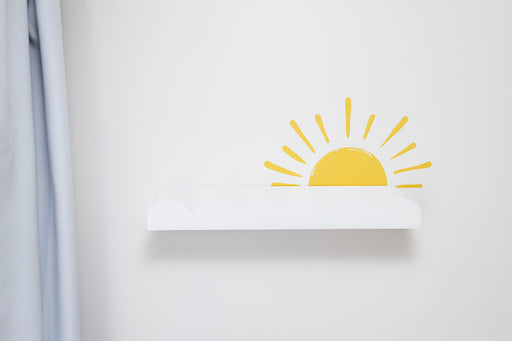White wall with a yellow sun reusable decal sticker design on a light gray wall