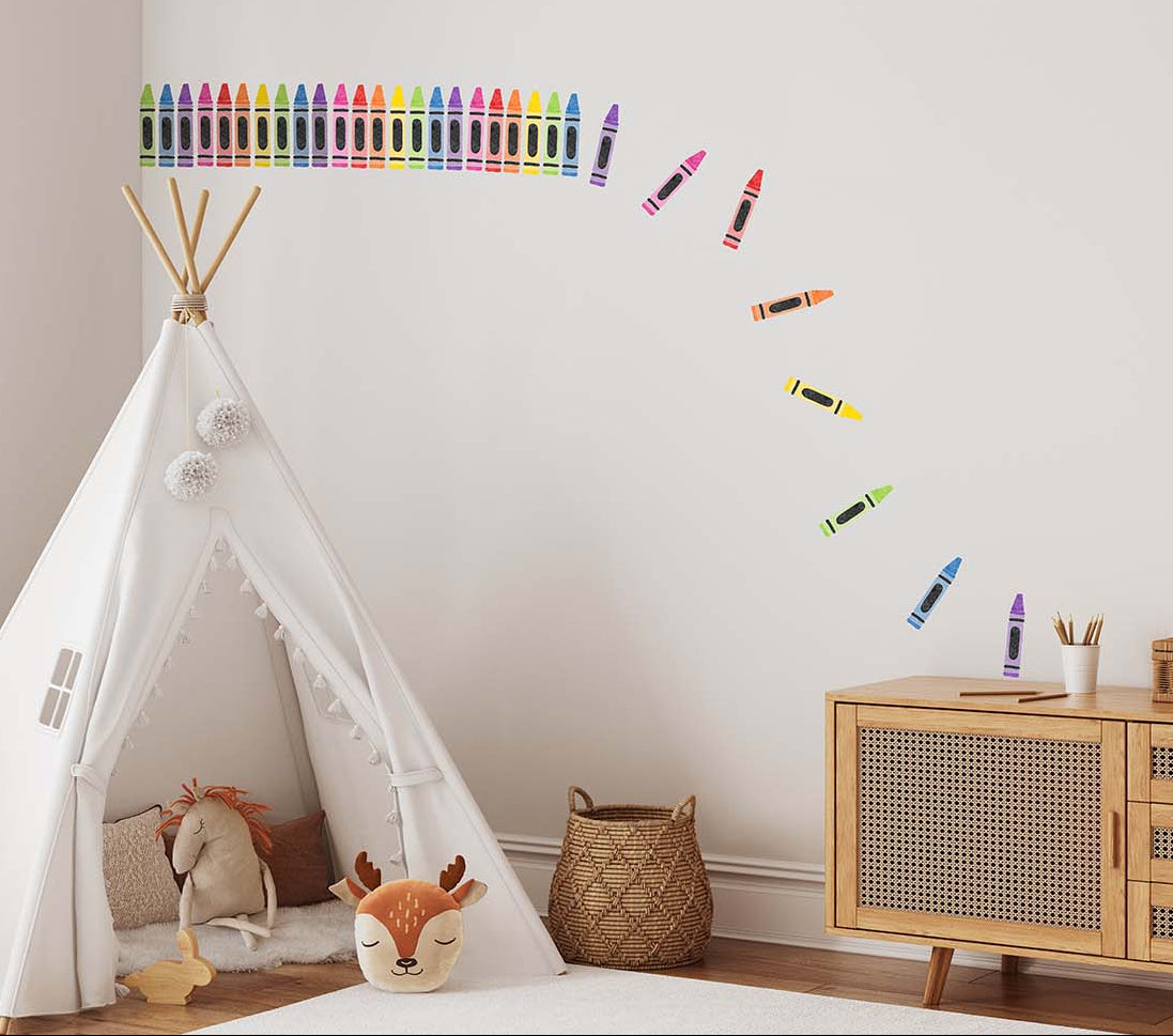 Children's room with a teepee, toys, and colourful crayon wall decal stickers on wall.
