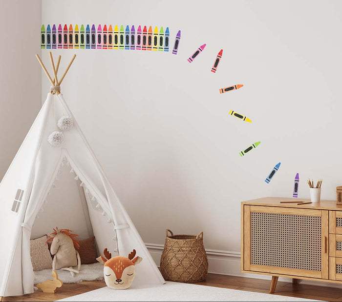 Children's room with a teepee, toys, and colourful crayon wall decal stickers on wall.