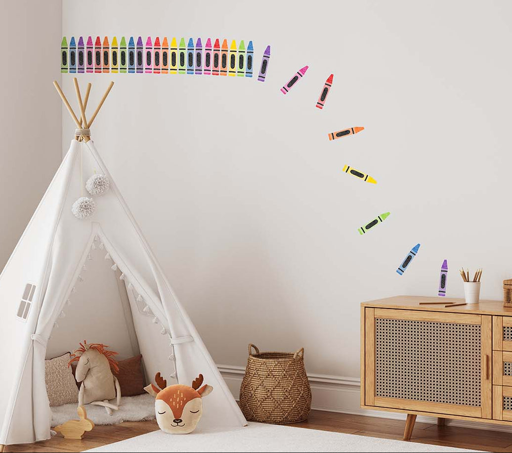 Children's room with a teepee, toys, and colourful crayon wall decal stickers on wall.