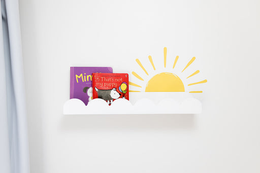 Children's book with a sun decal sticker on a white wall