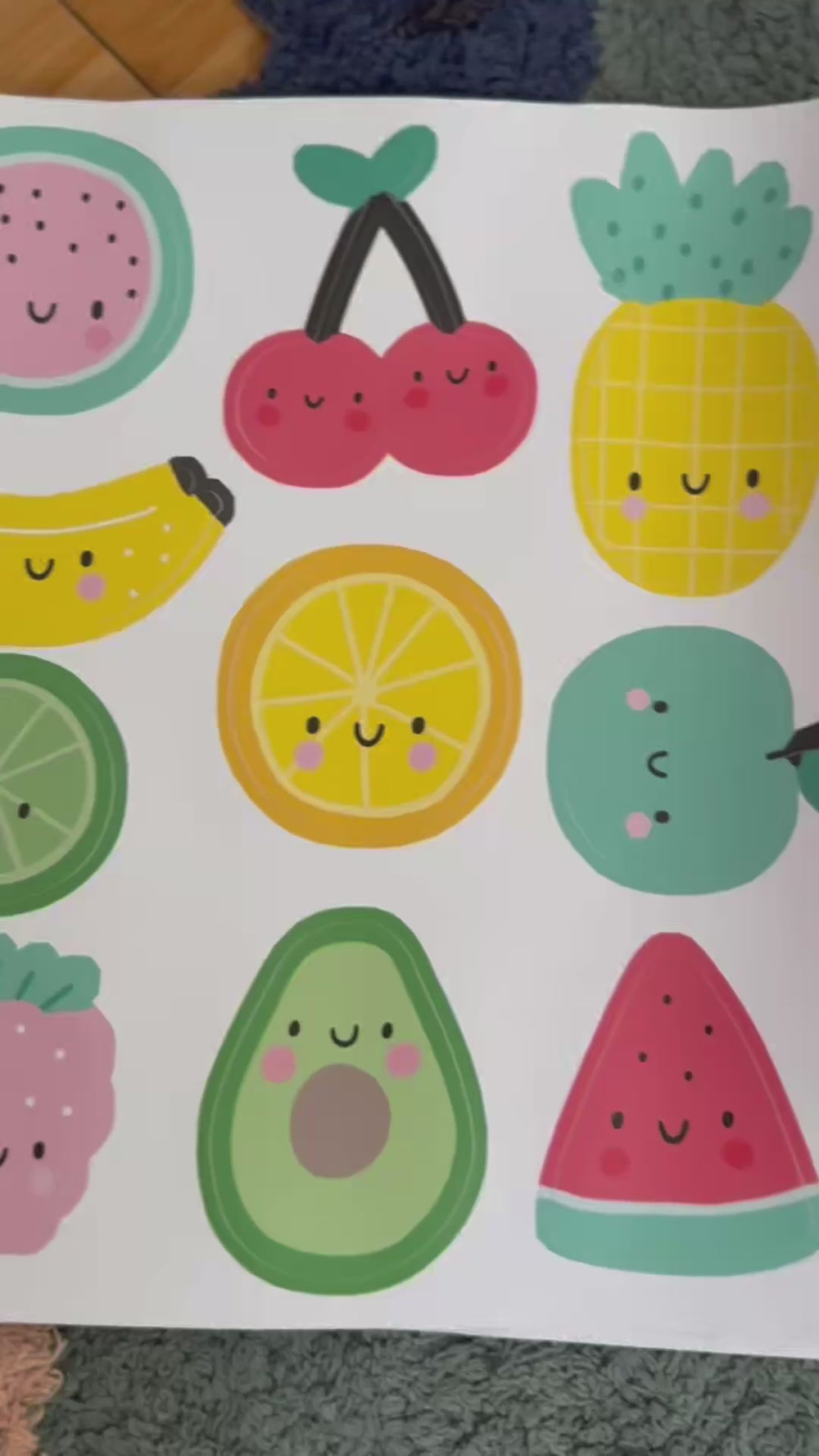 Video of fun fruit reusable wall decal stickers being applied to the wall by to boys