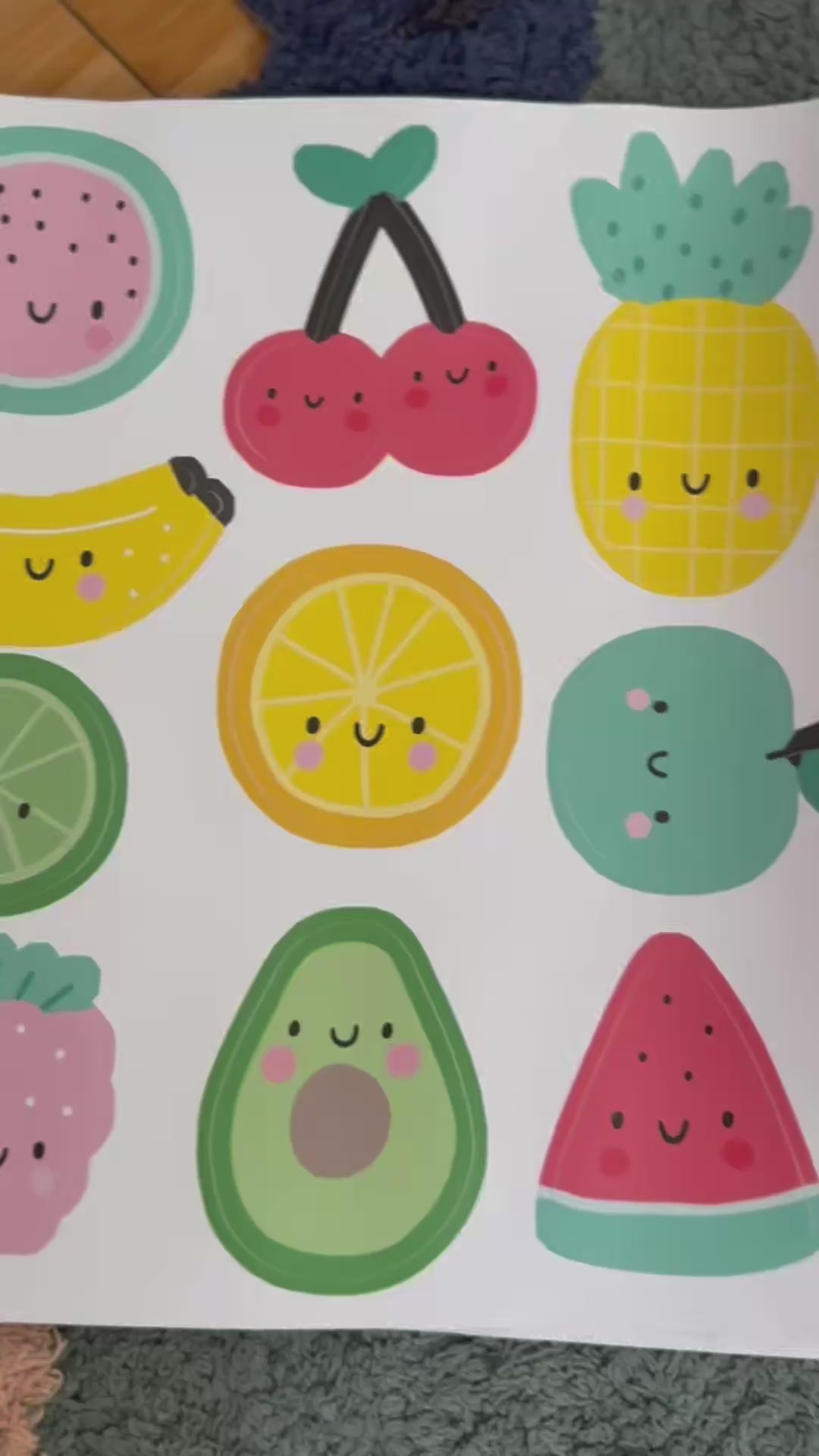 Video of fun fruit reusable wall decal stickers being applied to the wall by to boys